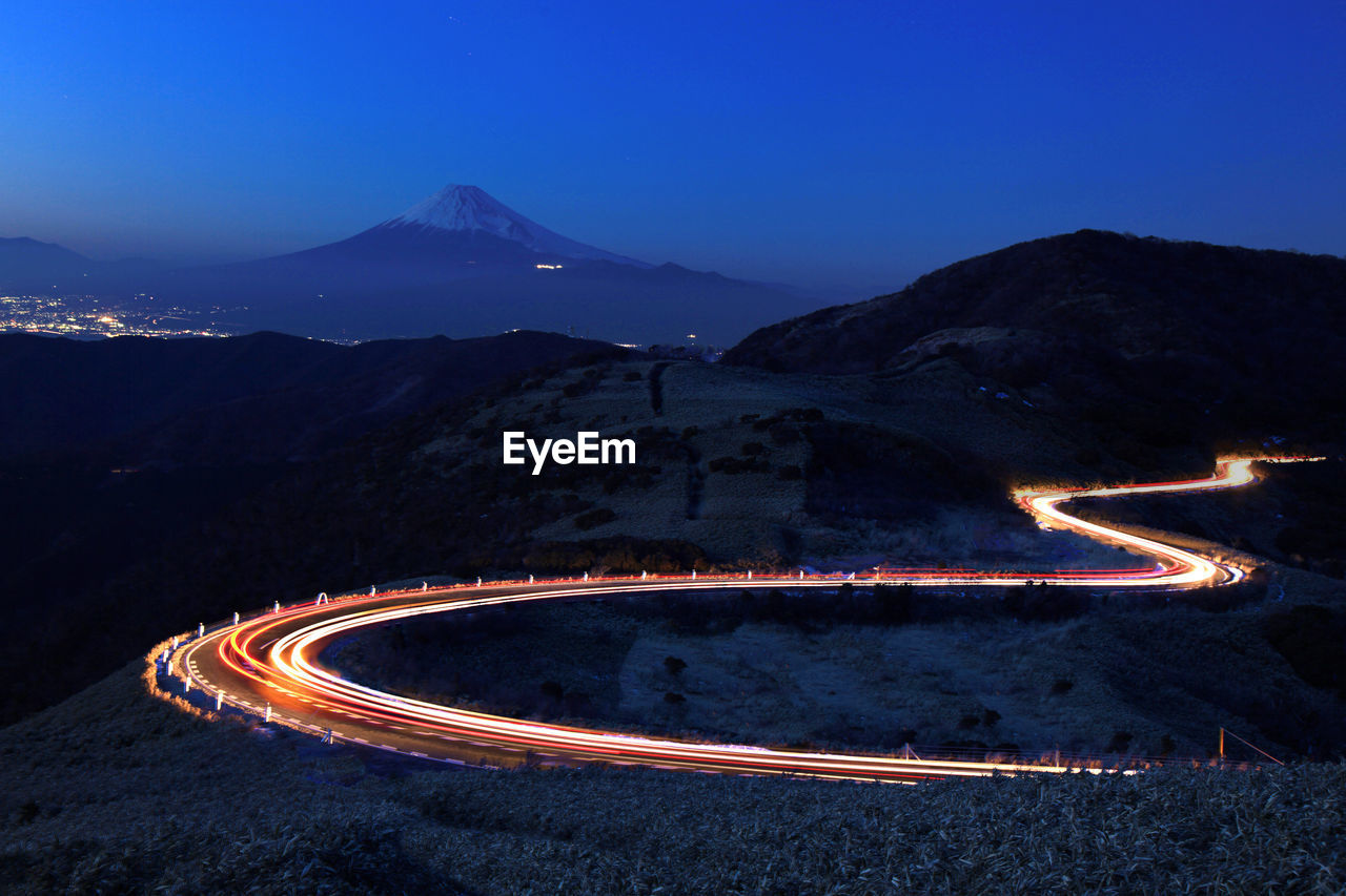 High angle view of light trails on road at night