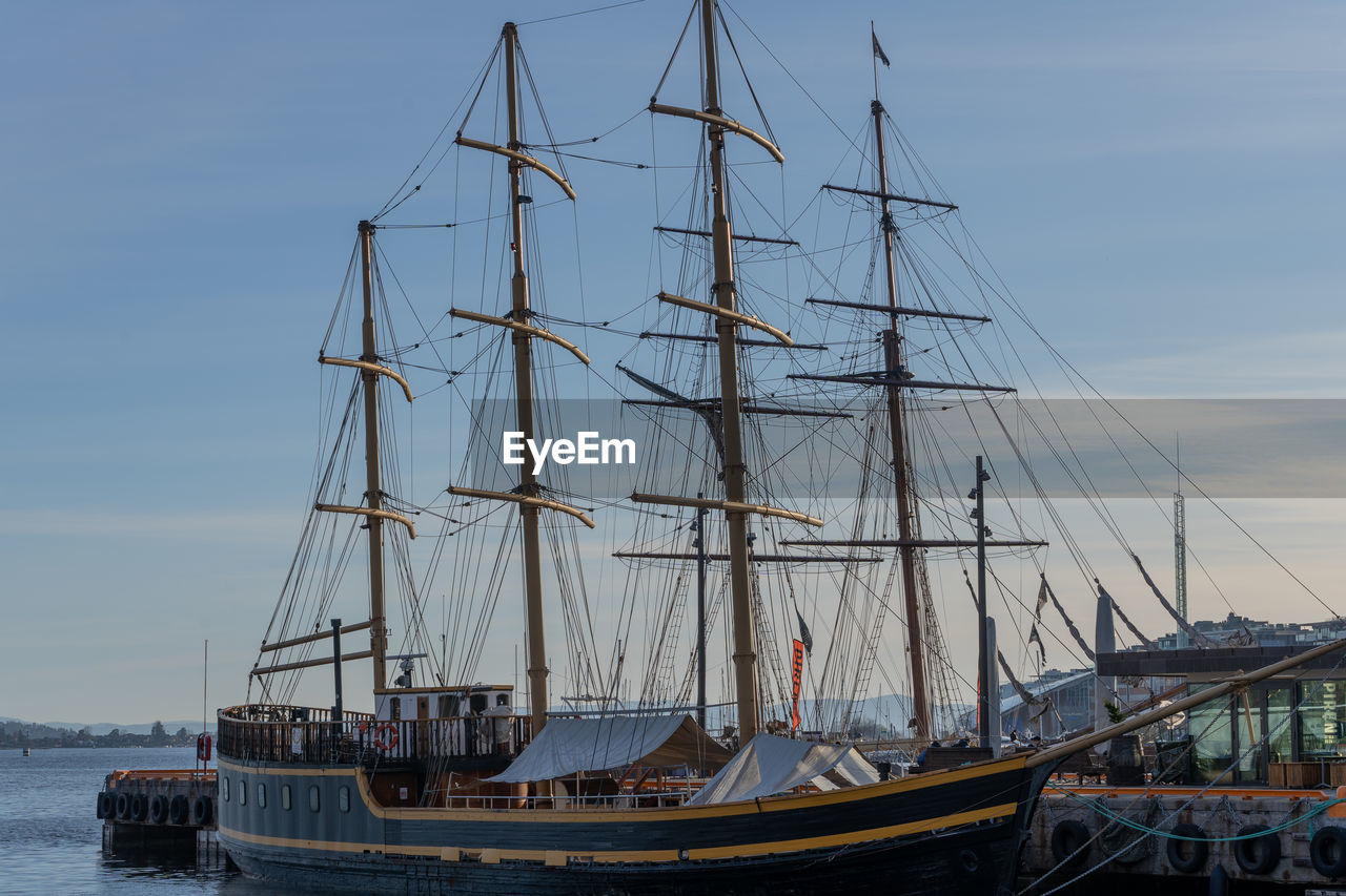 nautical vessel, transportation, water, sailboat, mode of transportation, sea, sailing, sailing ship, tall ship, ship, vehicle, mast, pole, sky, nature, barquentine, windjammer, boat, harbor, travel, no people, schooner, galleon, cloud, watercraft, outdoors, history, architecture, day, the past, passenger ship, travel destinations, beauty in nature, moored, blue, rigging