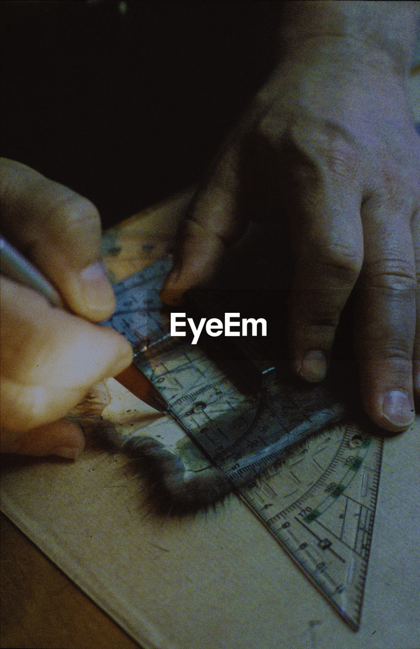 CLOSE-UP OF MAN WITH HAND