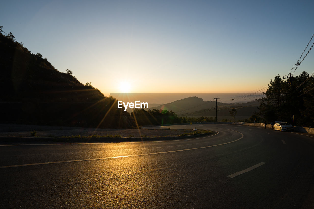 VIEW OF ROAD AT SUNSET