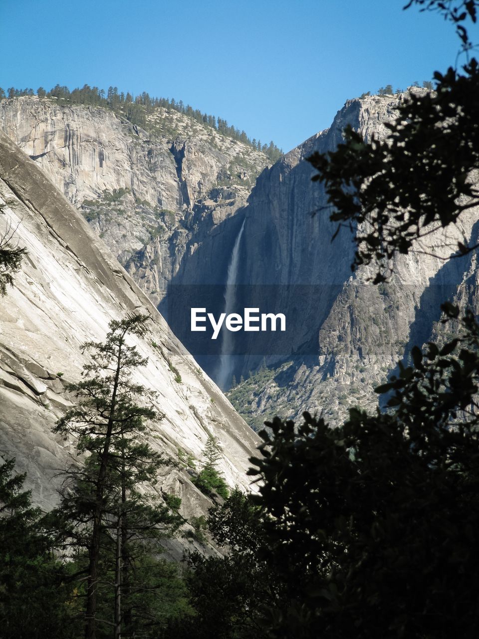 Scenic view of mountains with waterfall at yosemite national park