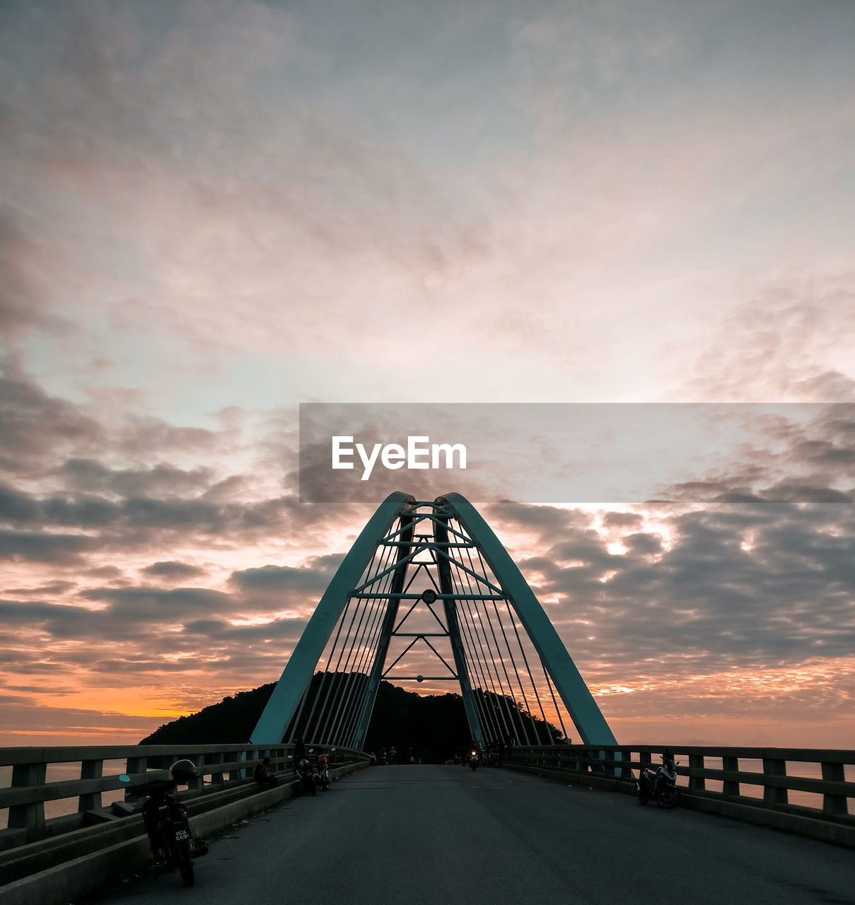 View of suspension bridge against sky during sunset