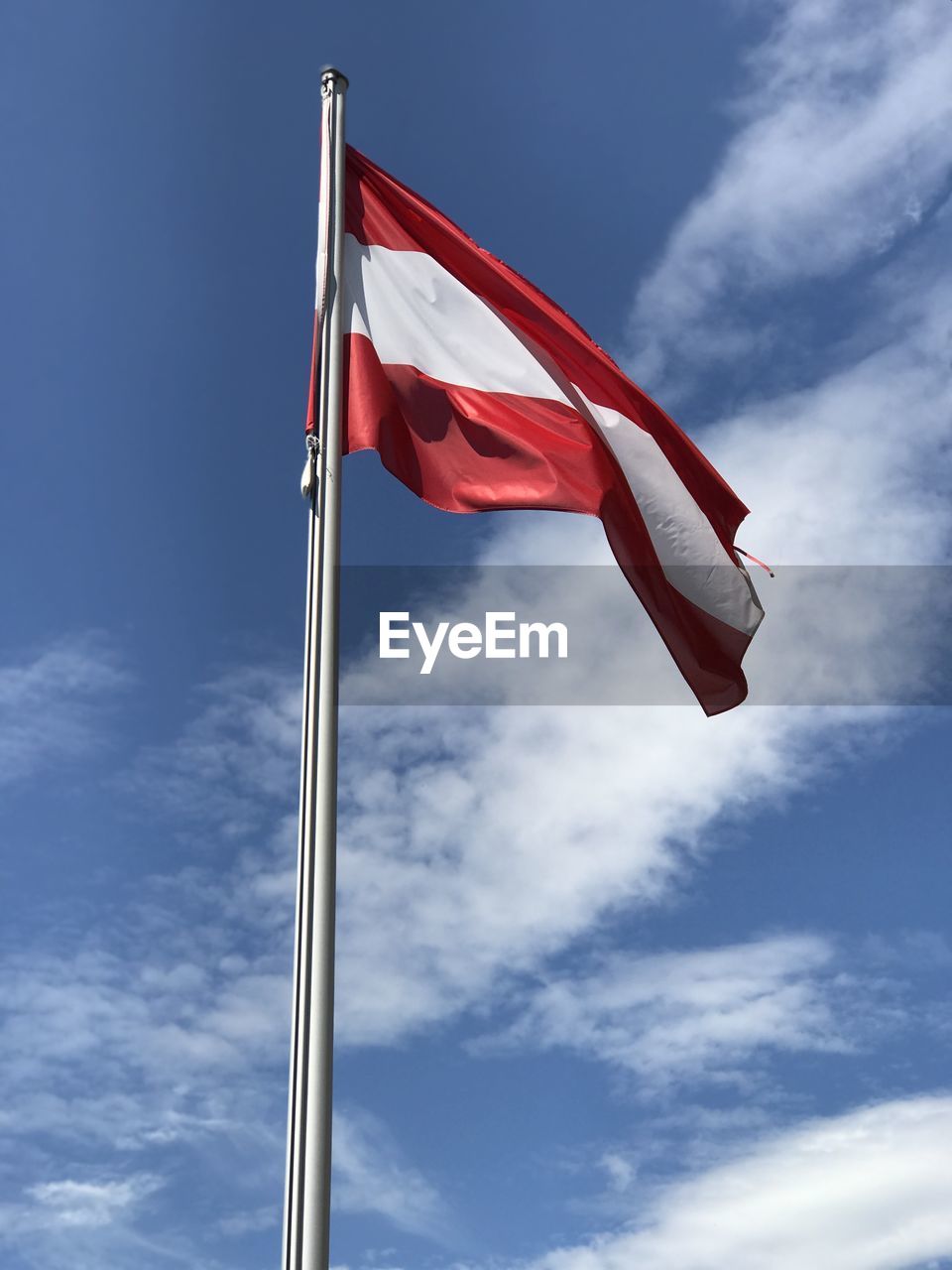 Low angle view of flag against sky