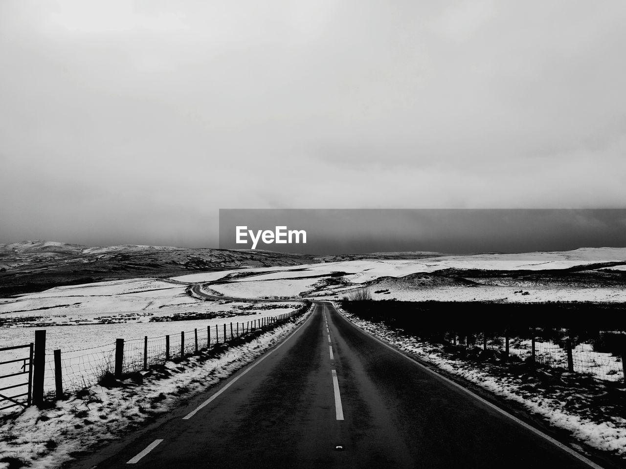ROAD IN WINTER LANDSCAPE