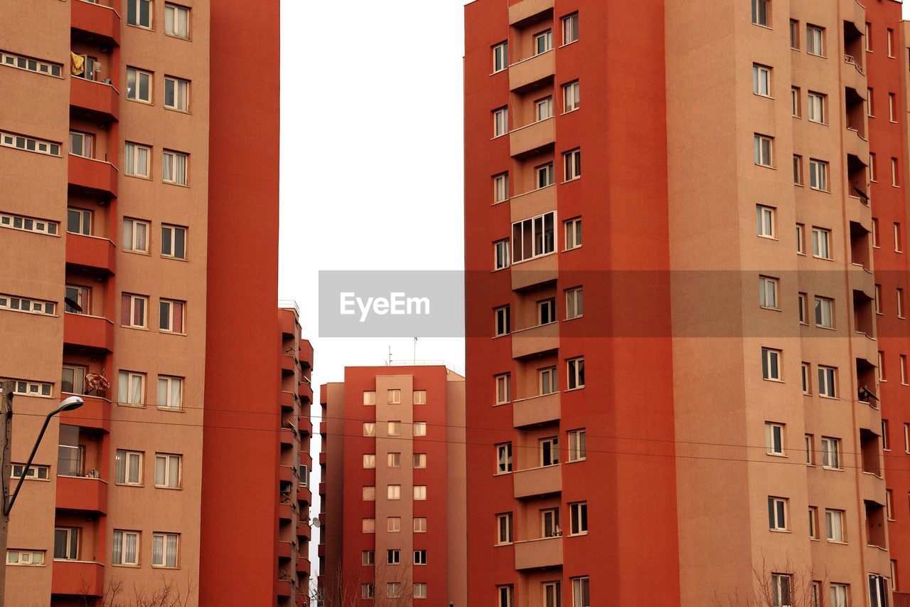 Low angle view of buildings against clear sky