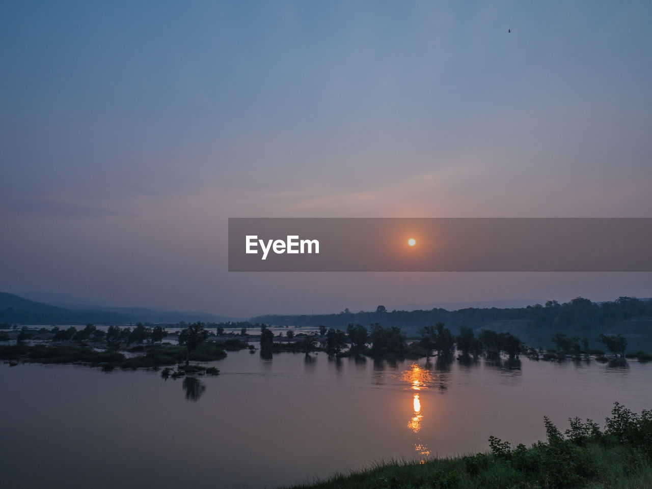 SCENIC VIEW OF LAKE DURING SUNSET