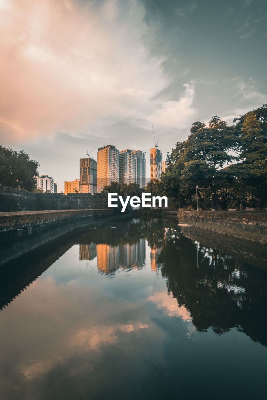 Reflection of skyscraper buildings during sunset