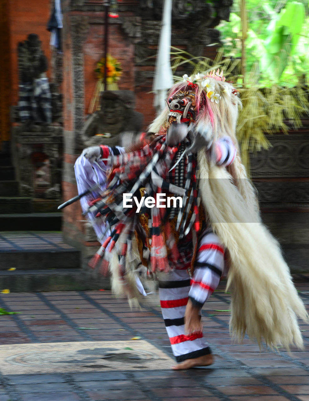 Artist in costume performing traditional dance