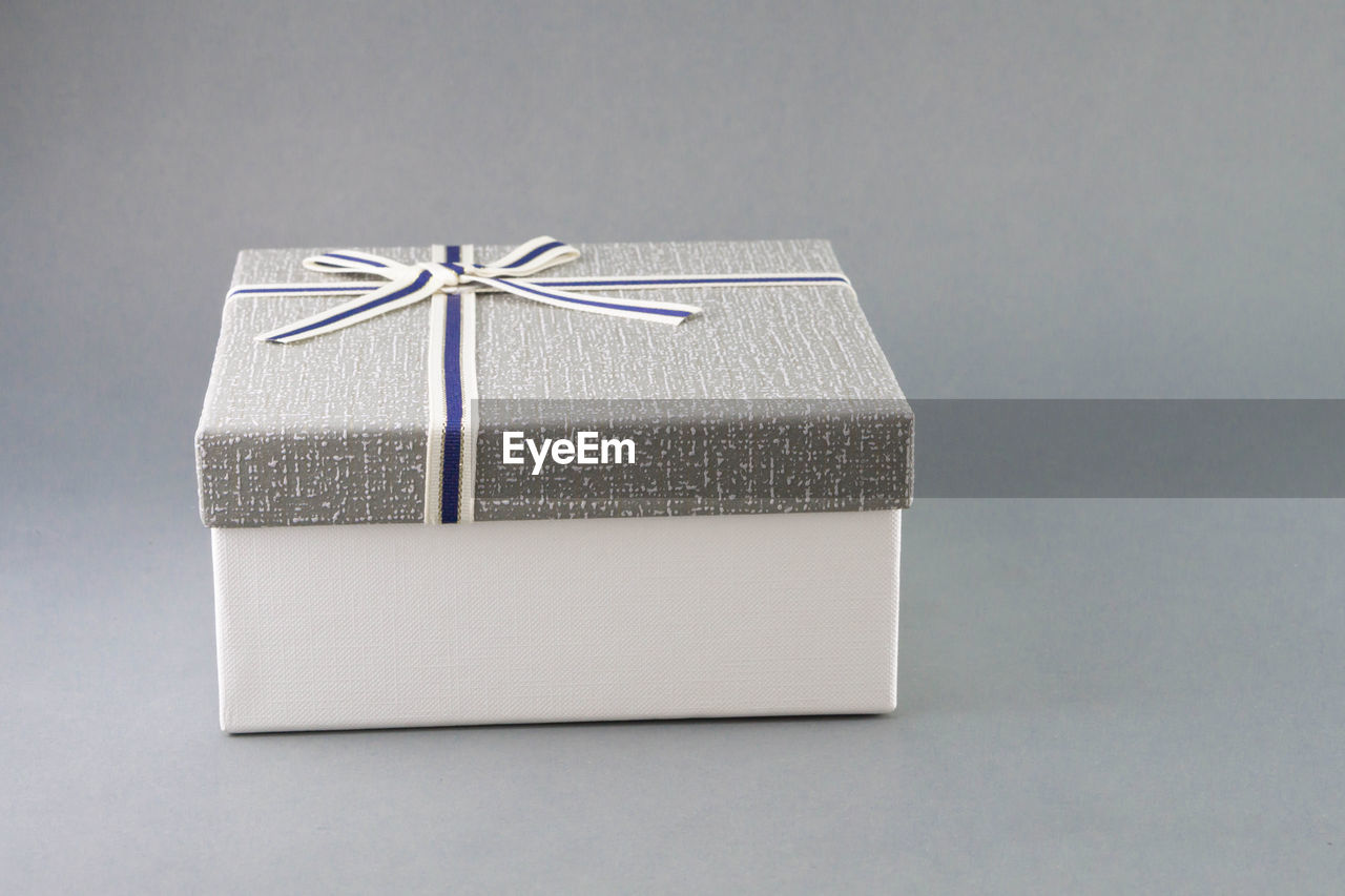 Close-up of gift box against gray background