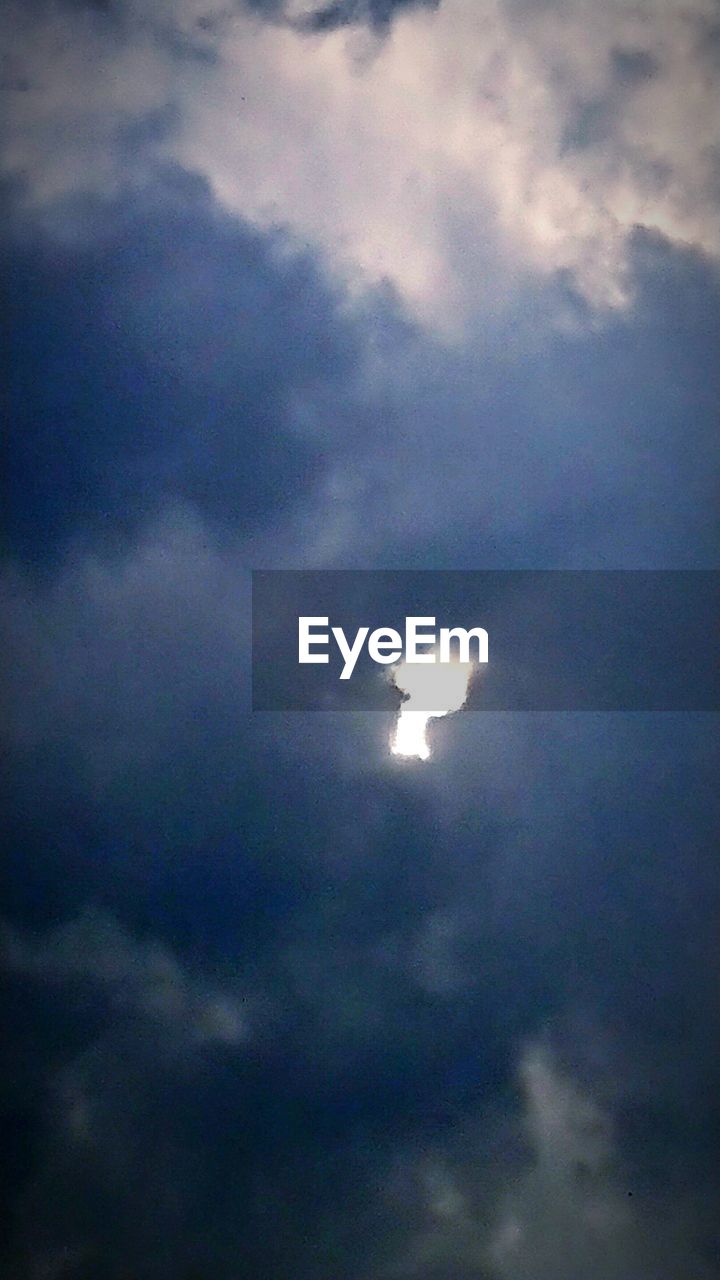 LOW ANGLE VIEW OF MOON IN SKY