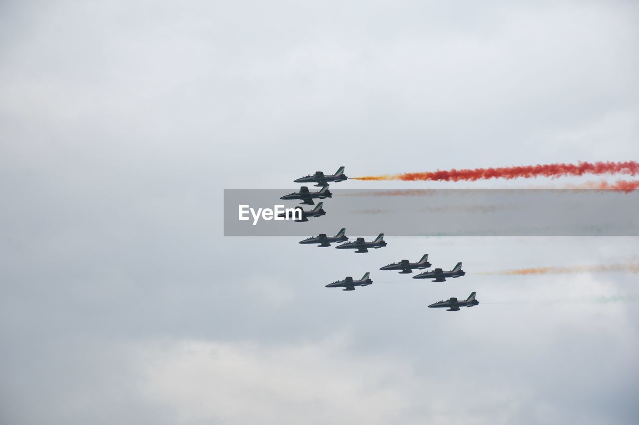 LOW ANGLE VIEW OF AIRSHOW IN SKY