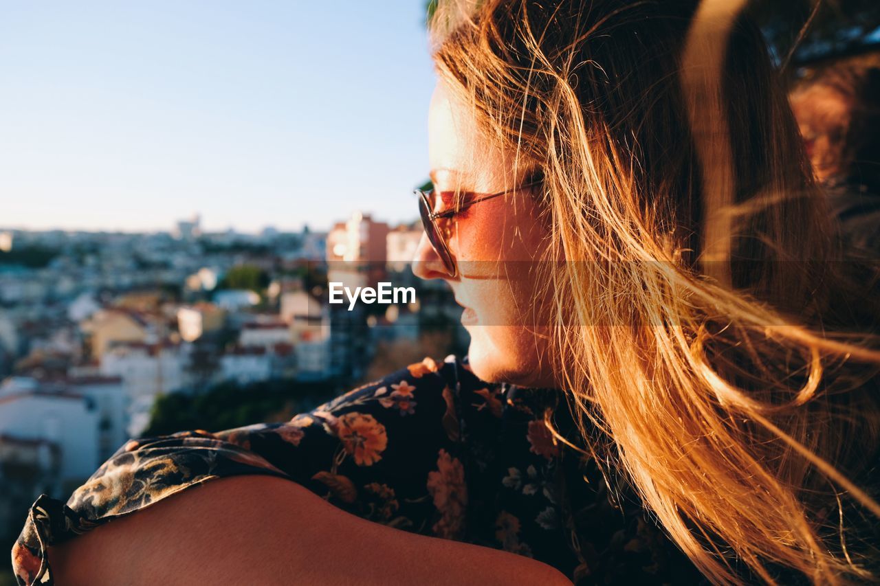 Close-up of young woman looking away