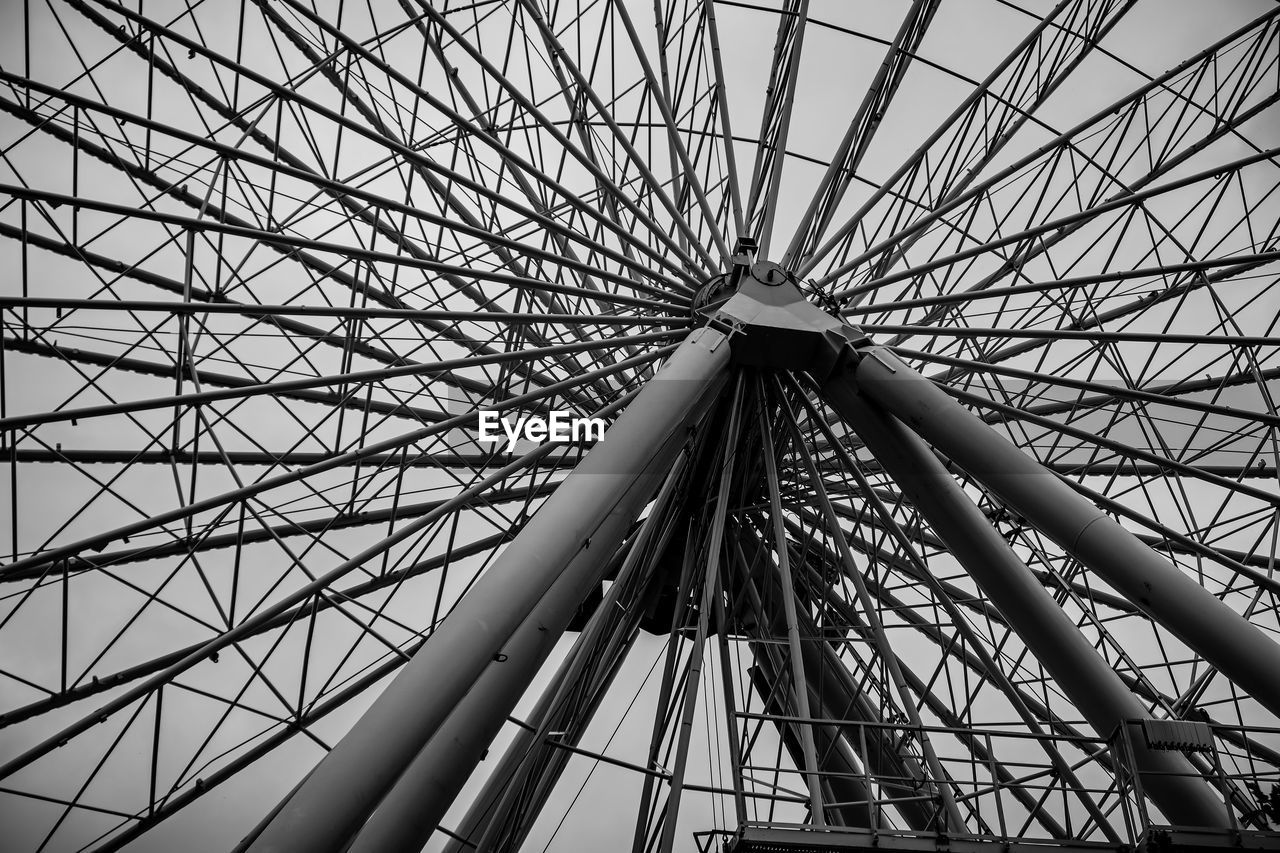 ferris wheel, amusement park, black and white, amusement park ride, arts culture and entertainment, monochrome, monochrome photography, built structure, recreation, sky, no people, low angle view, architecture, traveling carnival, carnival, metal, nature, pattern, line, outdoors, day, geometric shape, black, shape, fun, large