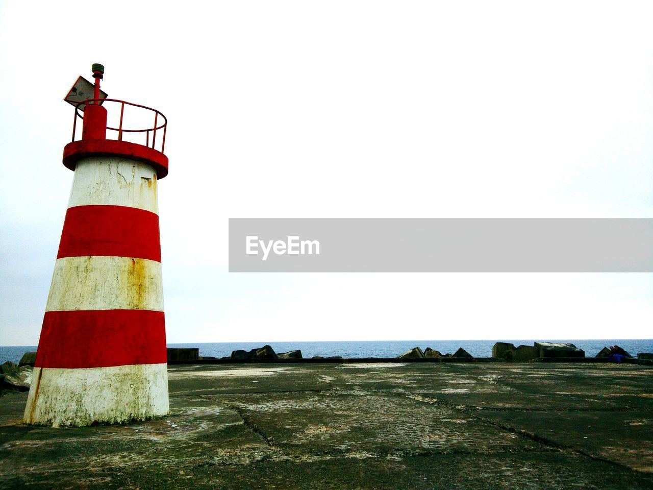 LIGHTHOUSE AGAINST SEA