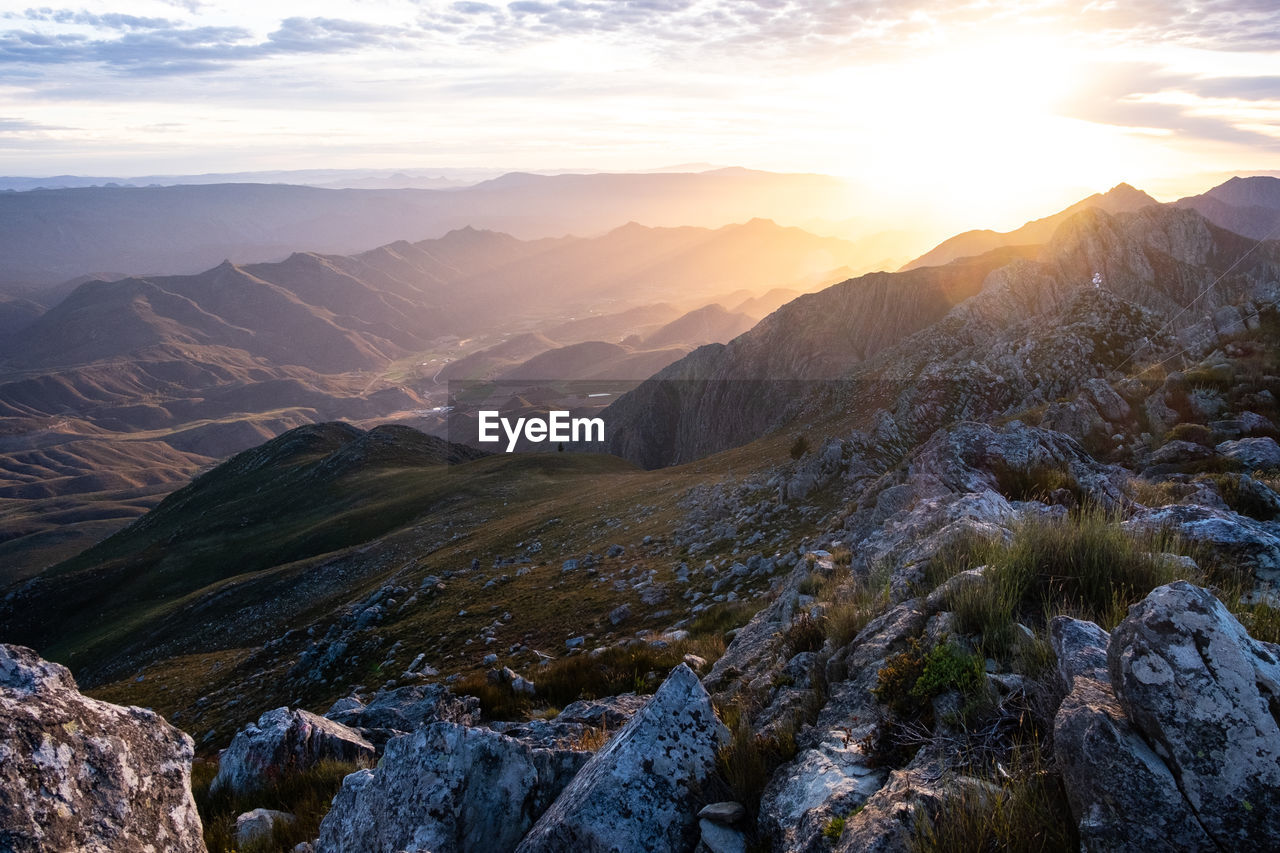 Scenic view of mountains against sky during sunrise