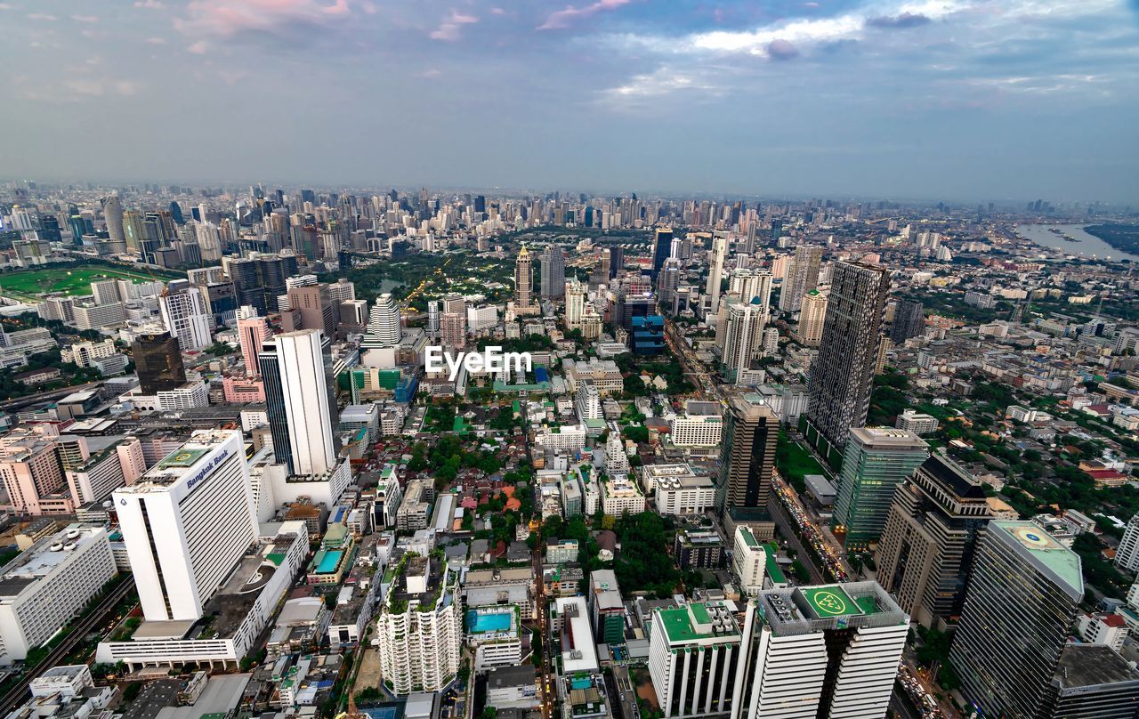 High angle view of modern buildings in city against sky