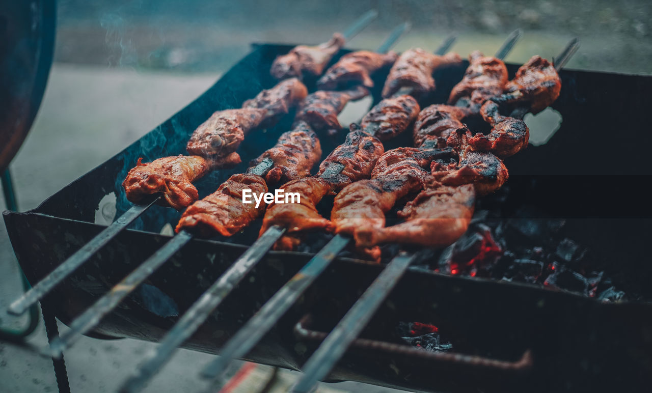 High angle view of meat on barbecue grill