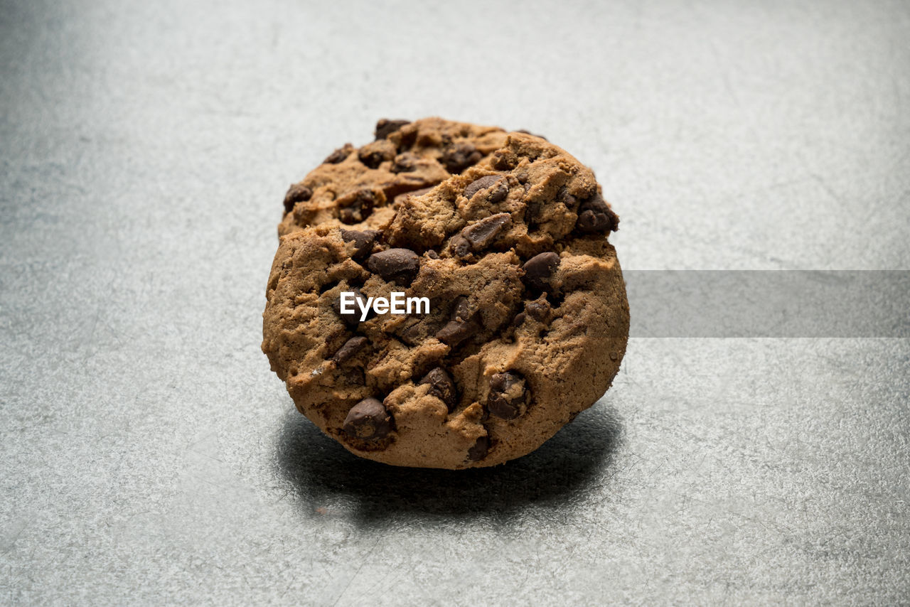 Close-up of chocolate chip cookie on table