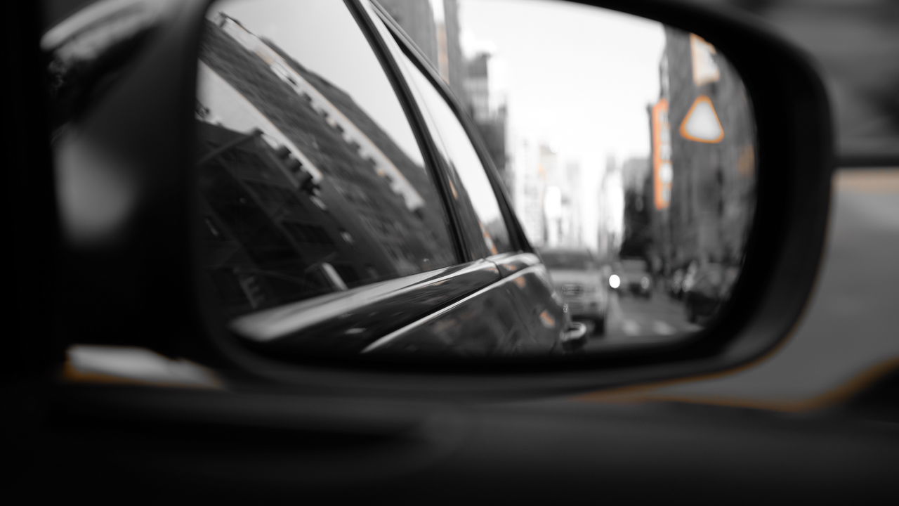 Reflection of car on side-view mirror