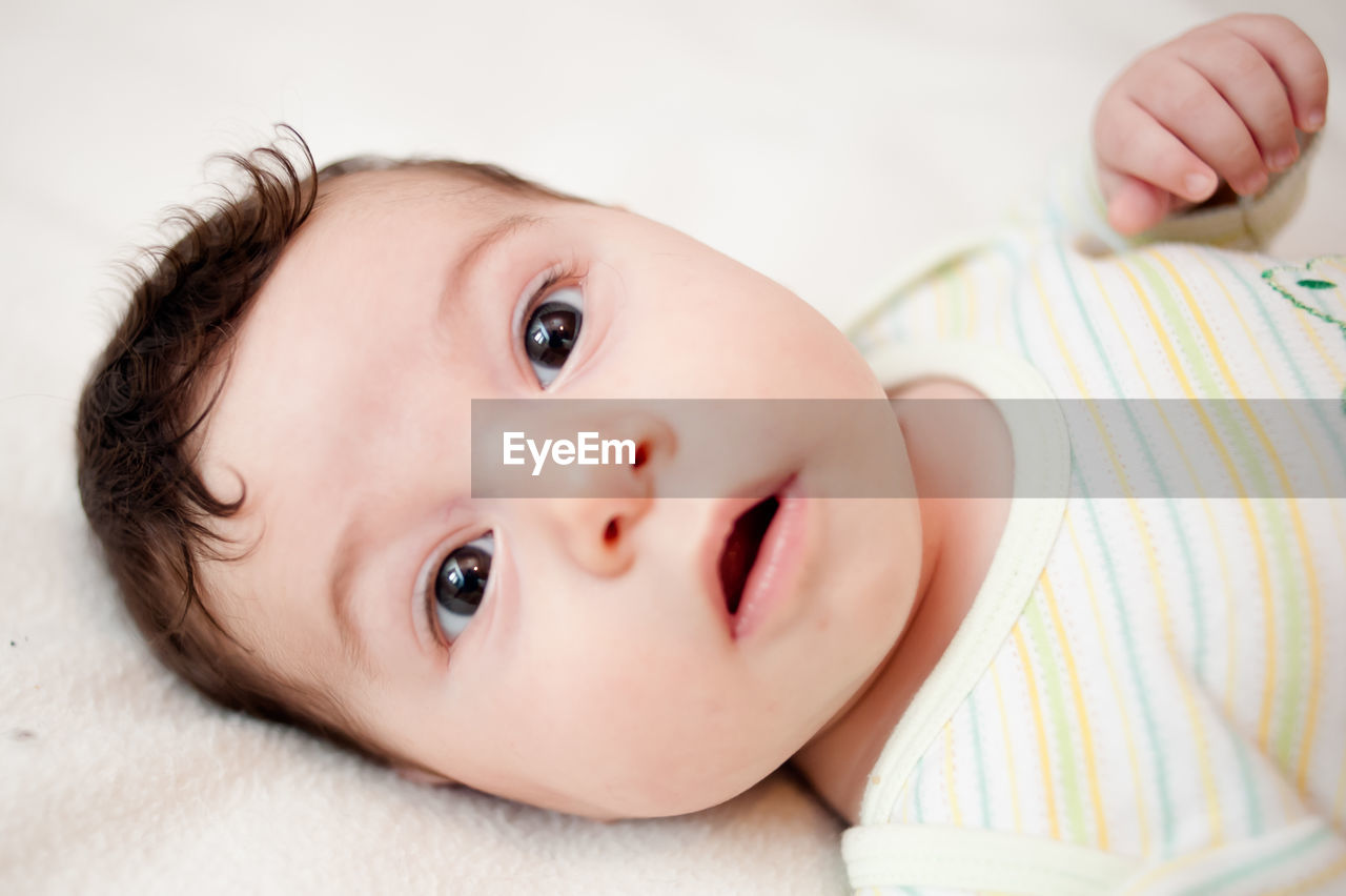 Cute baby boy on bed