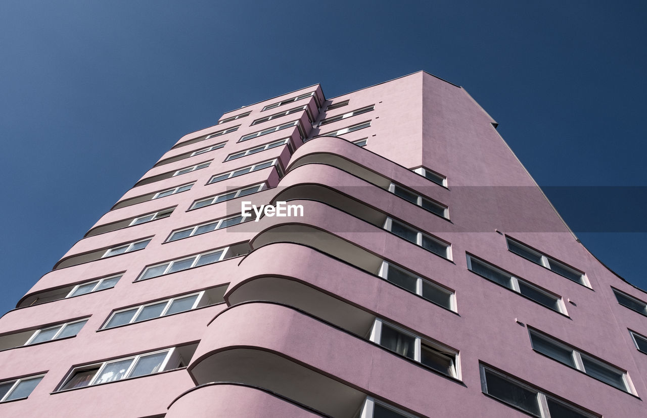 Low angle view of modern building against clear sky