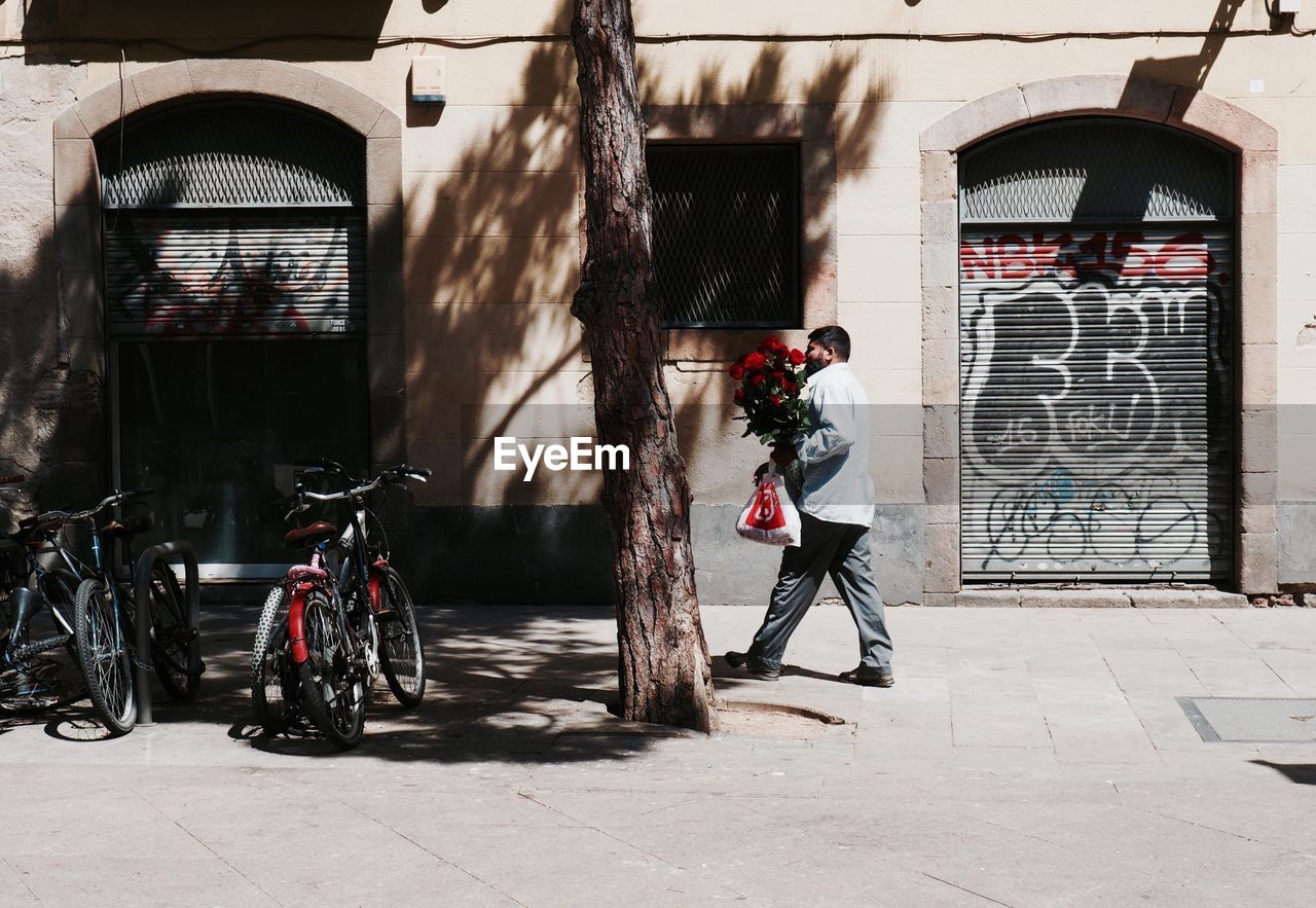 MAN CYCLING ON BICYCLE