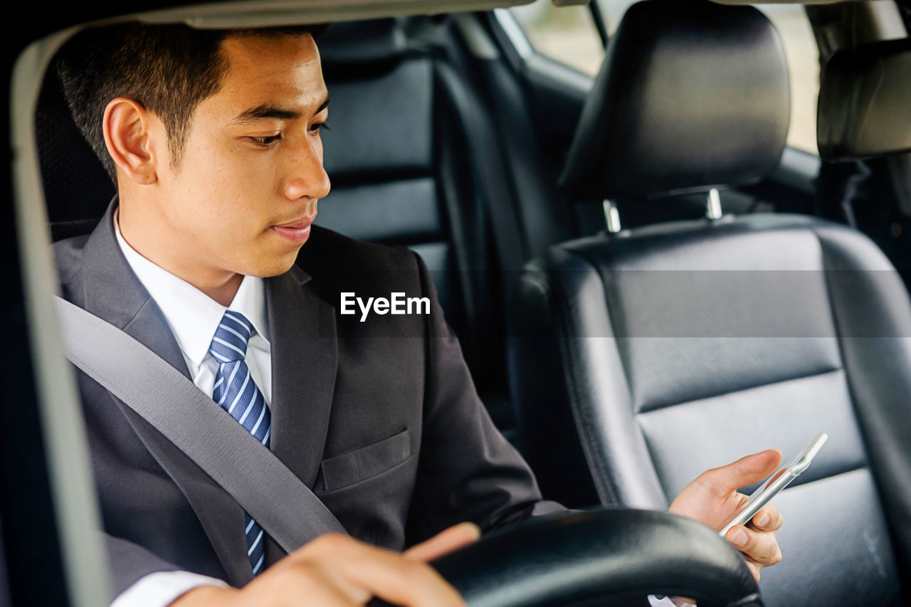 MAN SITTING IN CAR