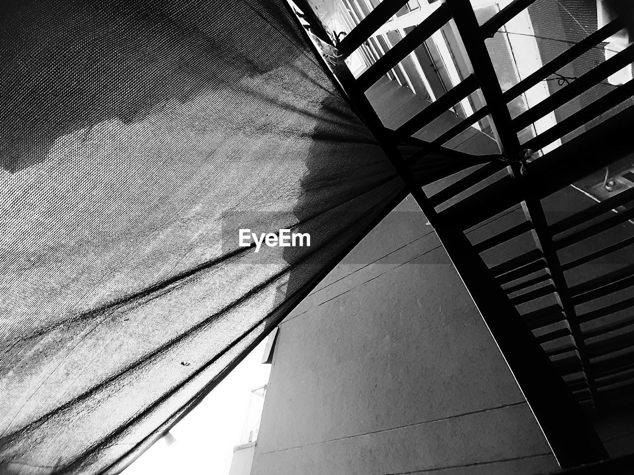 LOW ANGLE VIEW OF STAIRCASE AGAINST BUILDING