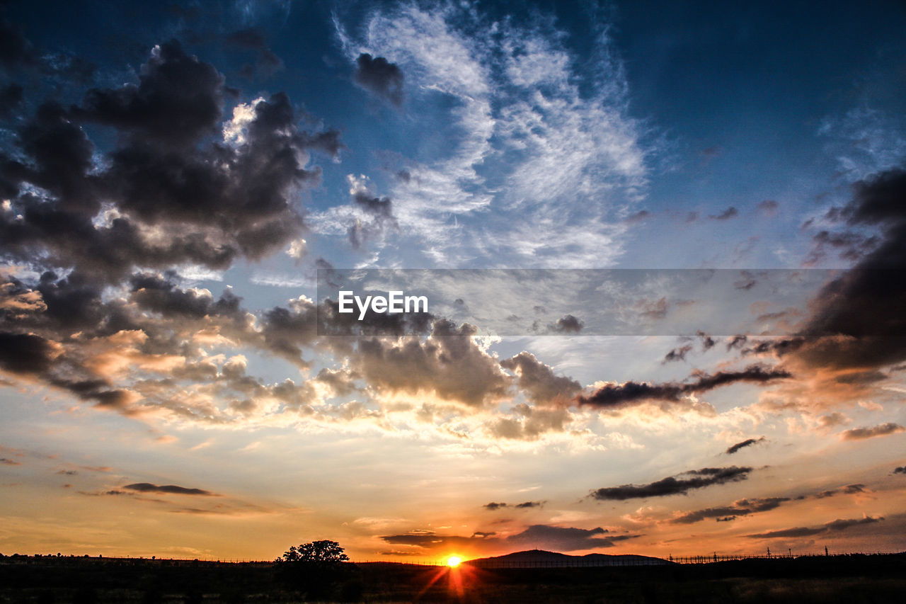 Scenic view of silhouette landscape against sky during sunset