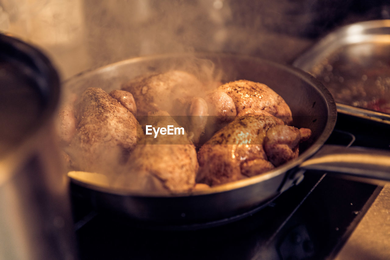 High angle view of meat in cooking pan