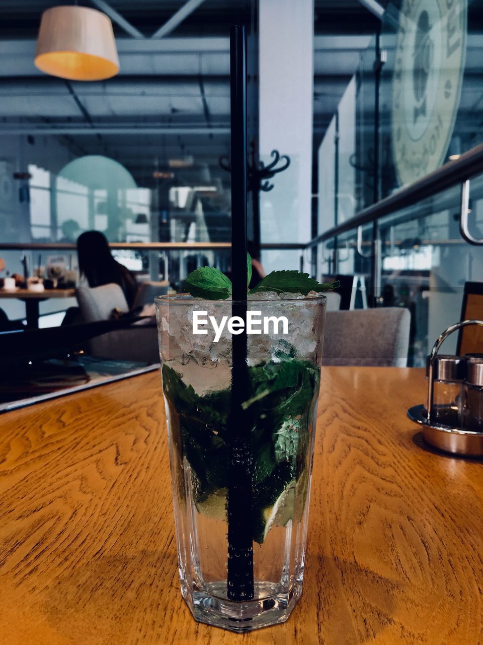 CLOSE-UP OF BEER GLASS ON TABLE