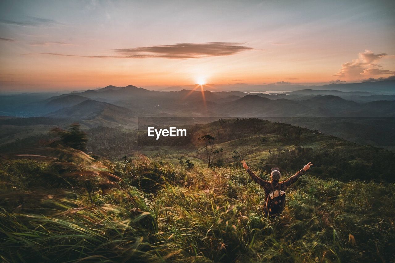 Scenic view of mountain against cloudy sky