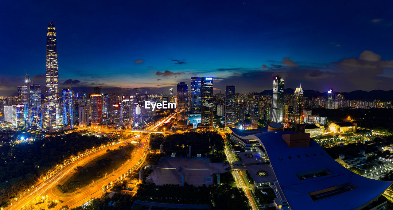 High angle view of illuminated buildings in city at night