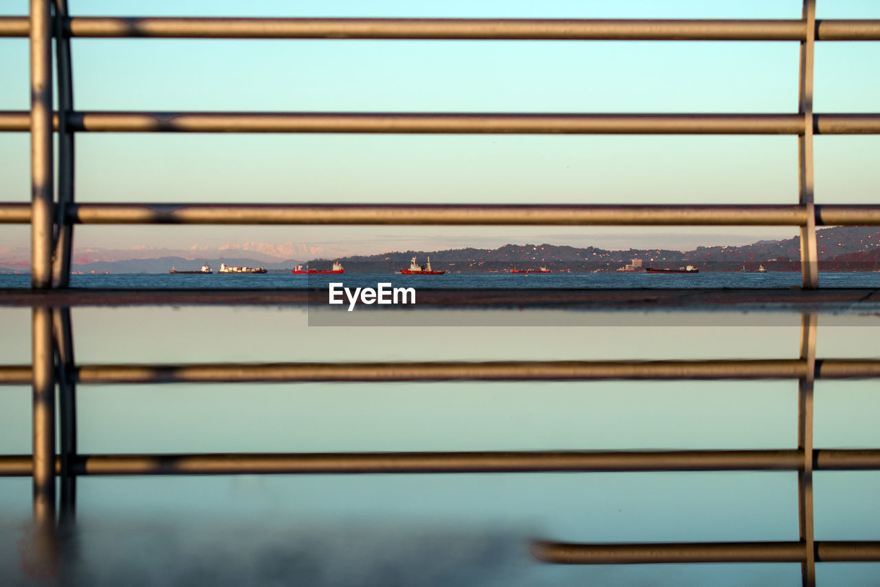 Full frame shot of railing against sky