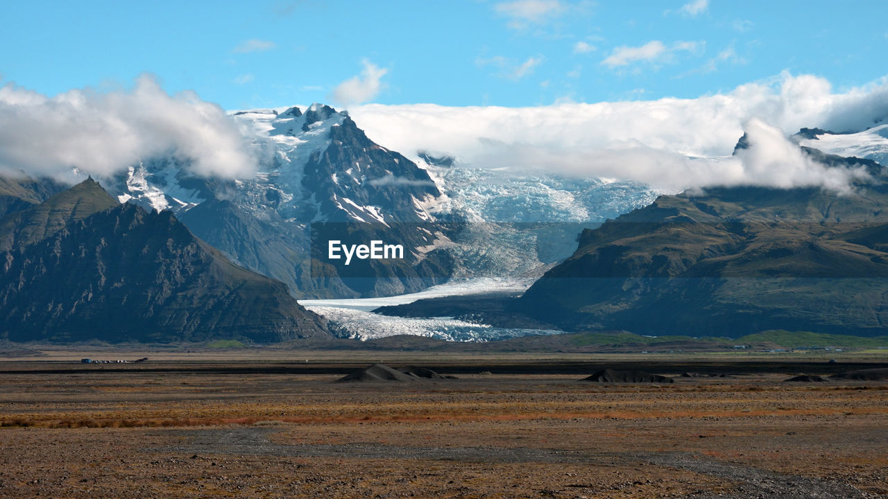 Scenic view of snowcapped mountains against sky