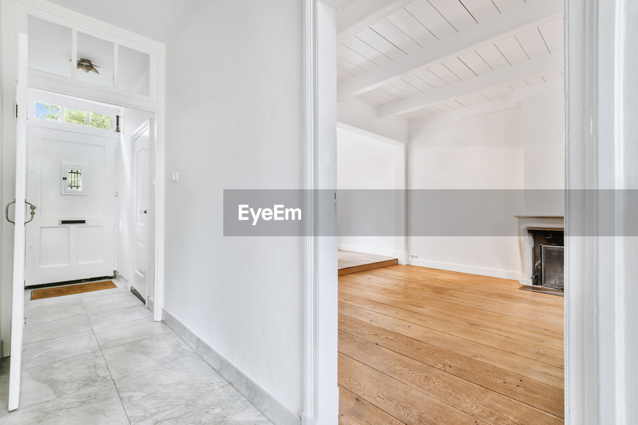 INTERIOR OF EMPTY ROOM WITH BUILDING