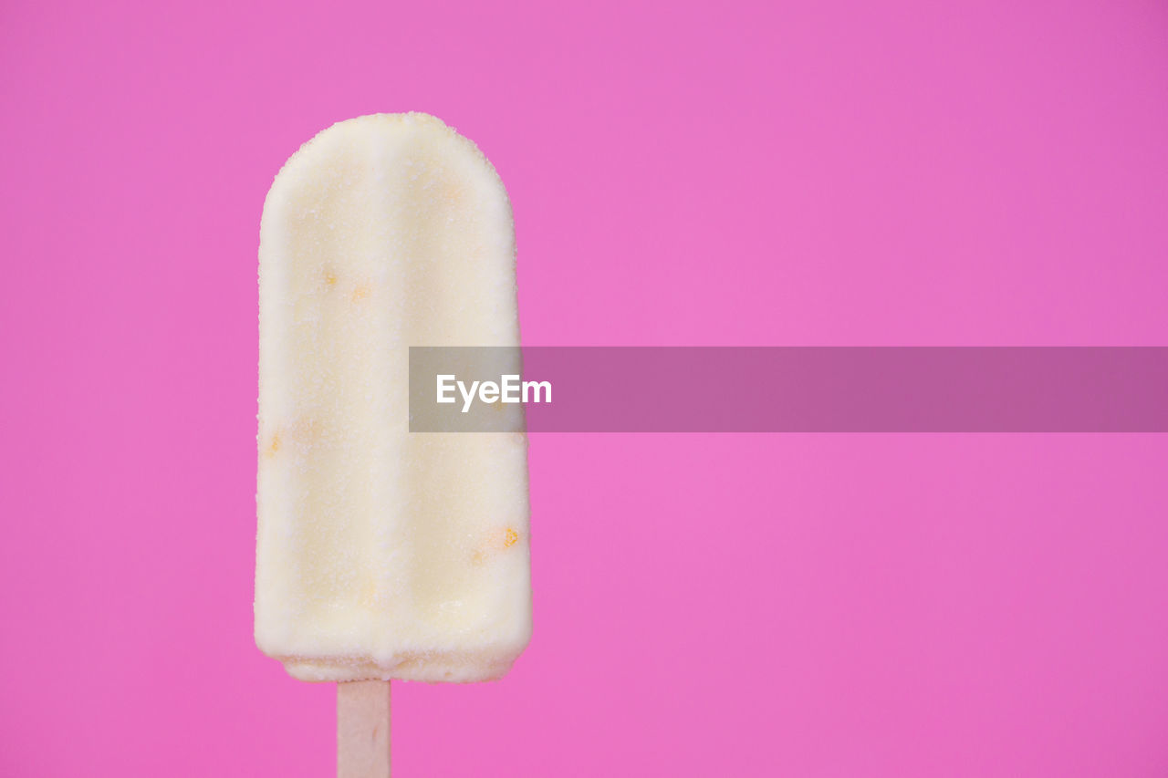 Close-up of ice cream against pink background