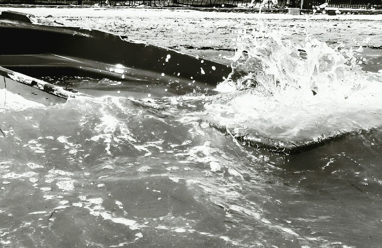 WAVES SPLASHING ON ROCKS