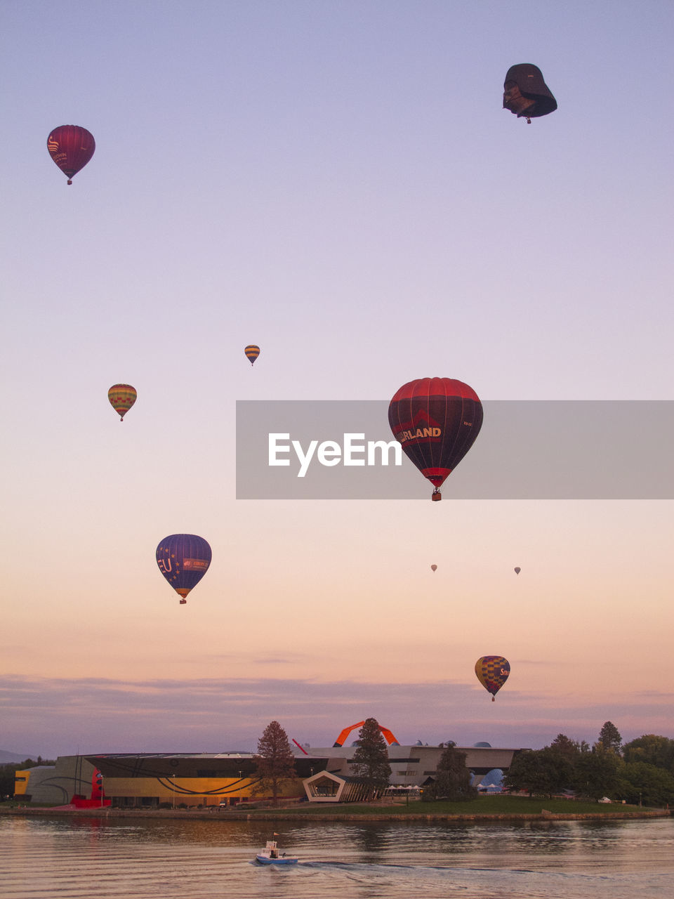 HOT AIR BALLOONS FLYING IN SKY DURING SUNSET