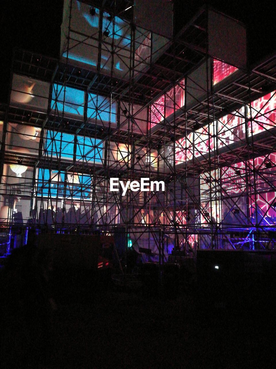 LOW ANGLE VIEW OF ILLUMINATED FERRIS WHEEL