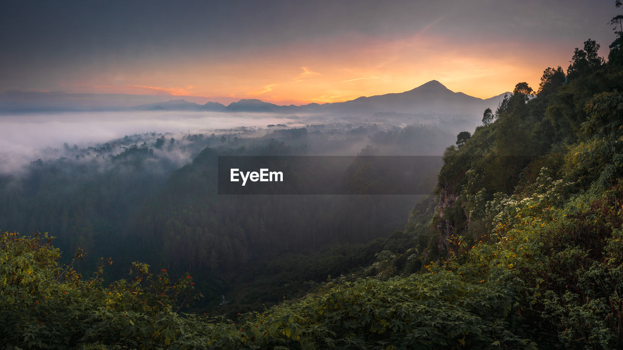 Scenic view of mountains against sky during sunset