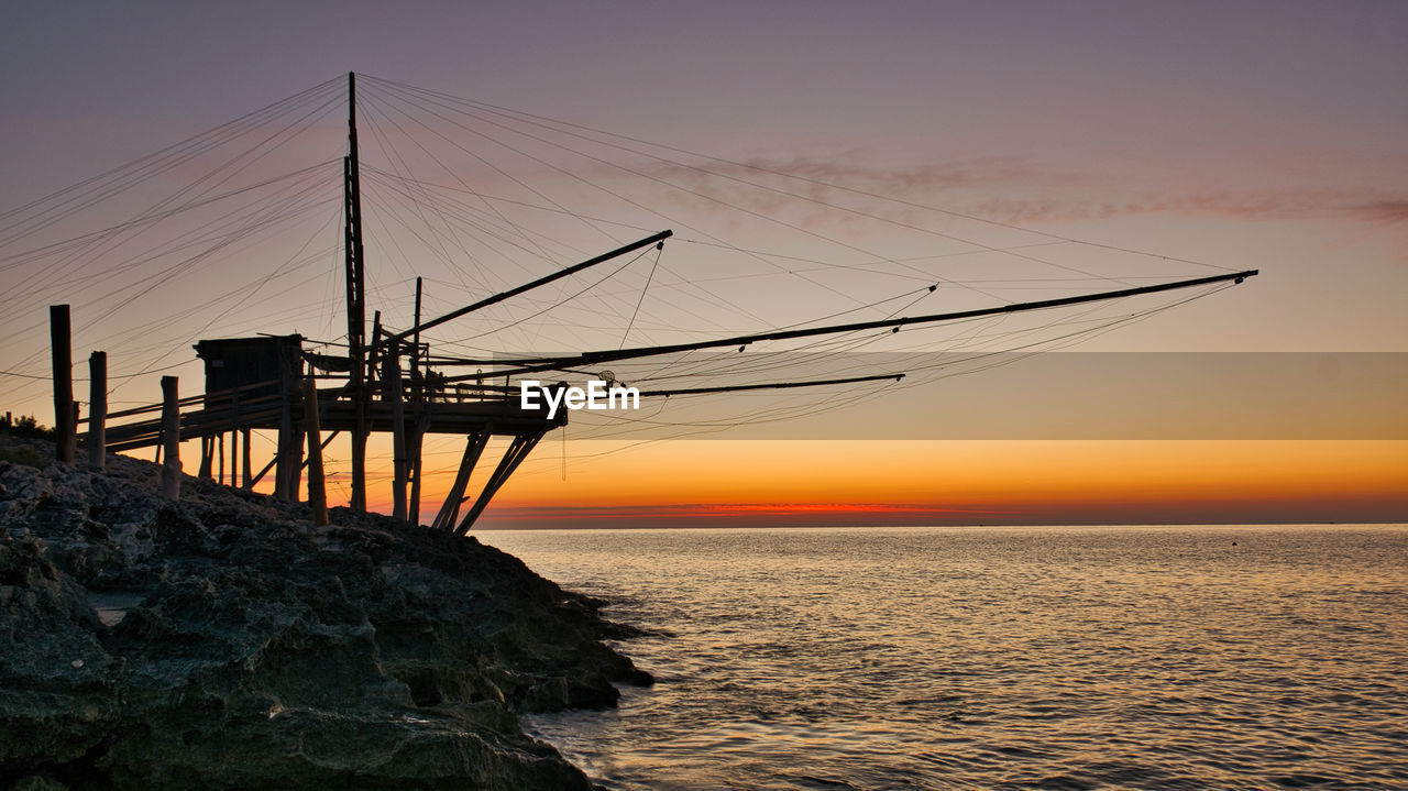 Scenic view of sea against sky during sunrise