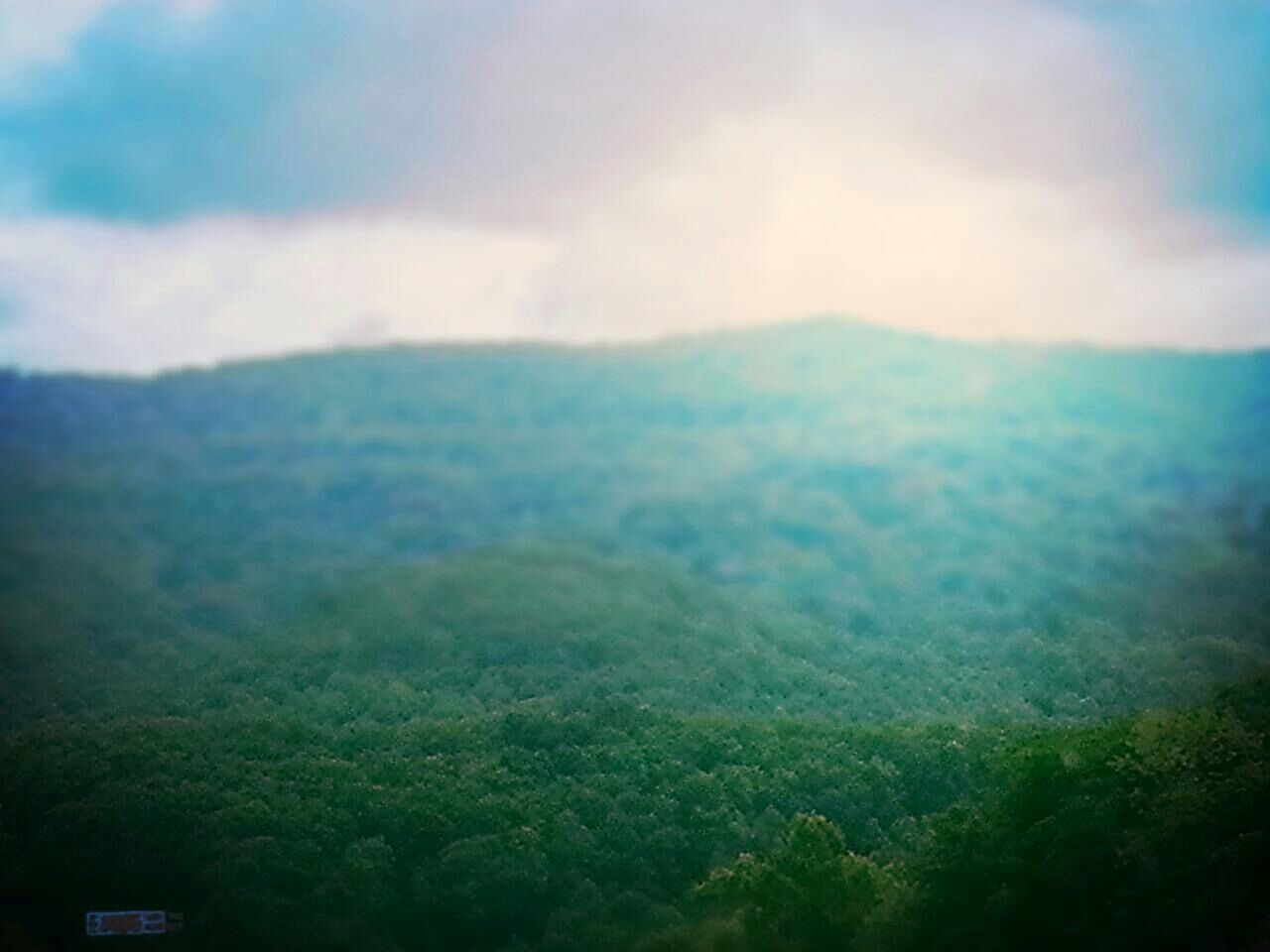 Scenic view of mountains during foggy weather