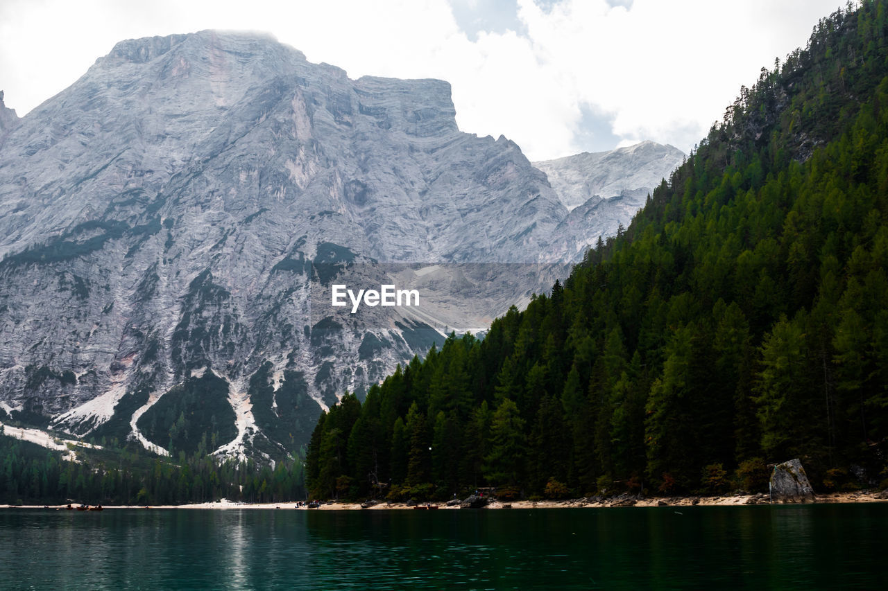 Scenic view of lake and mountains against sky