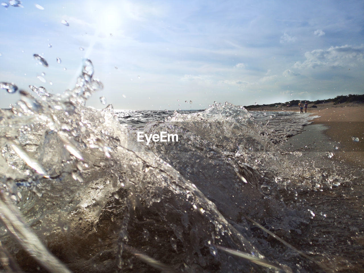 SCENIC VIEW OF SEA WAVES SPLASHING ON ROCKS