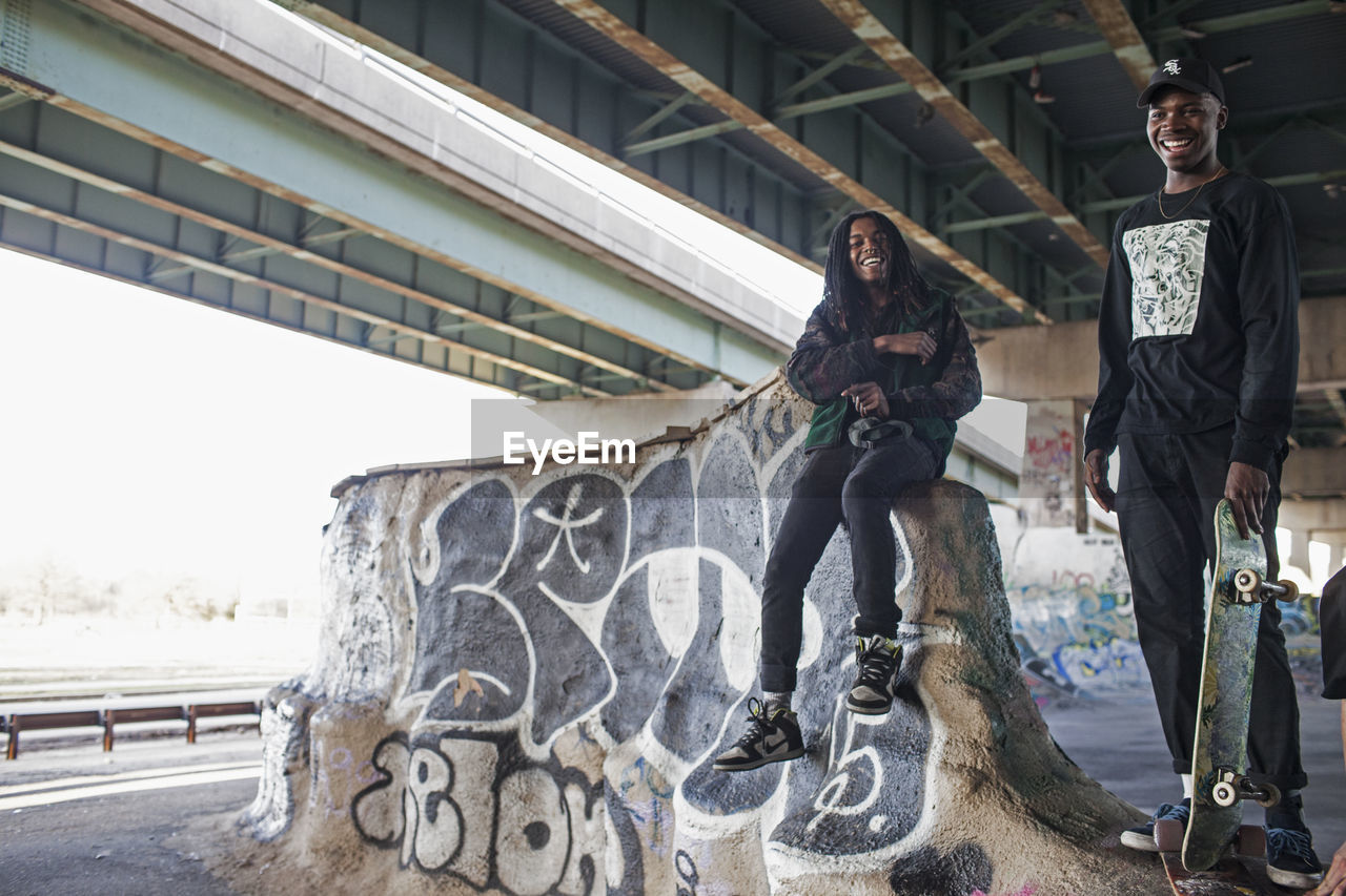 Two young men at a skateboard park.