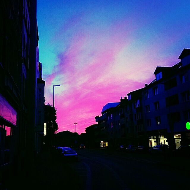 VIEW OF CITY STREET AT SUNSET