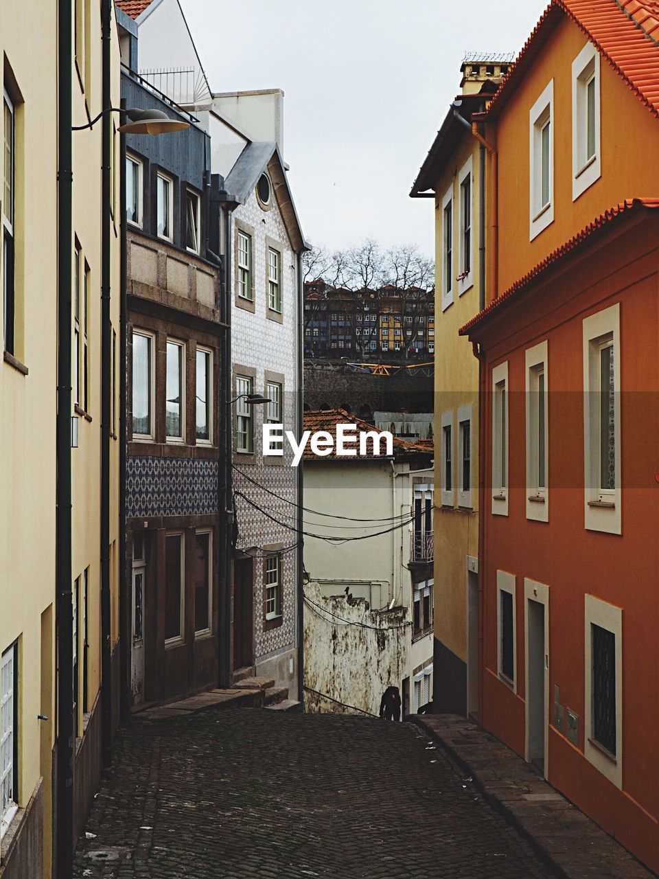 Narrow street amidst buildings in town