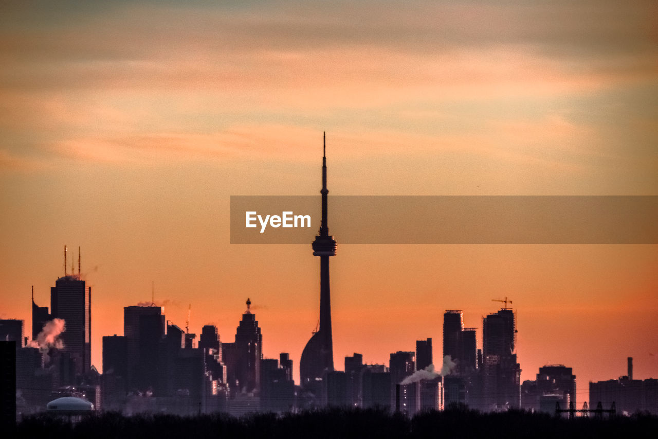 View of communications tower in city