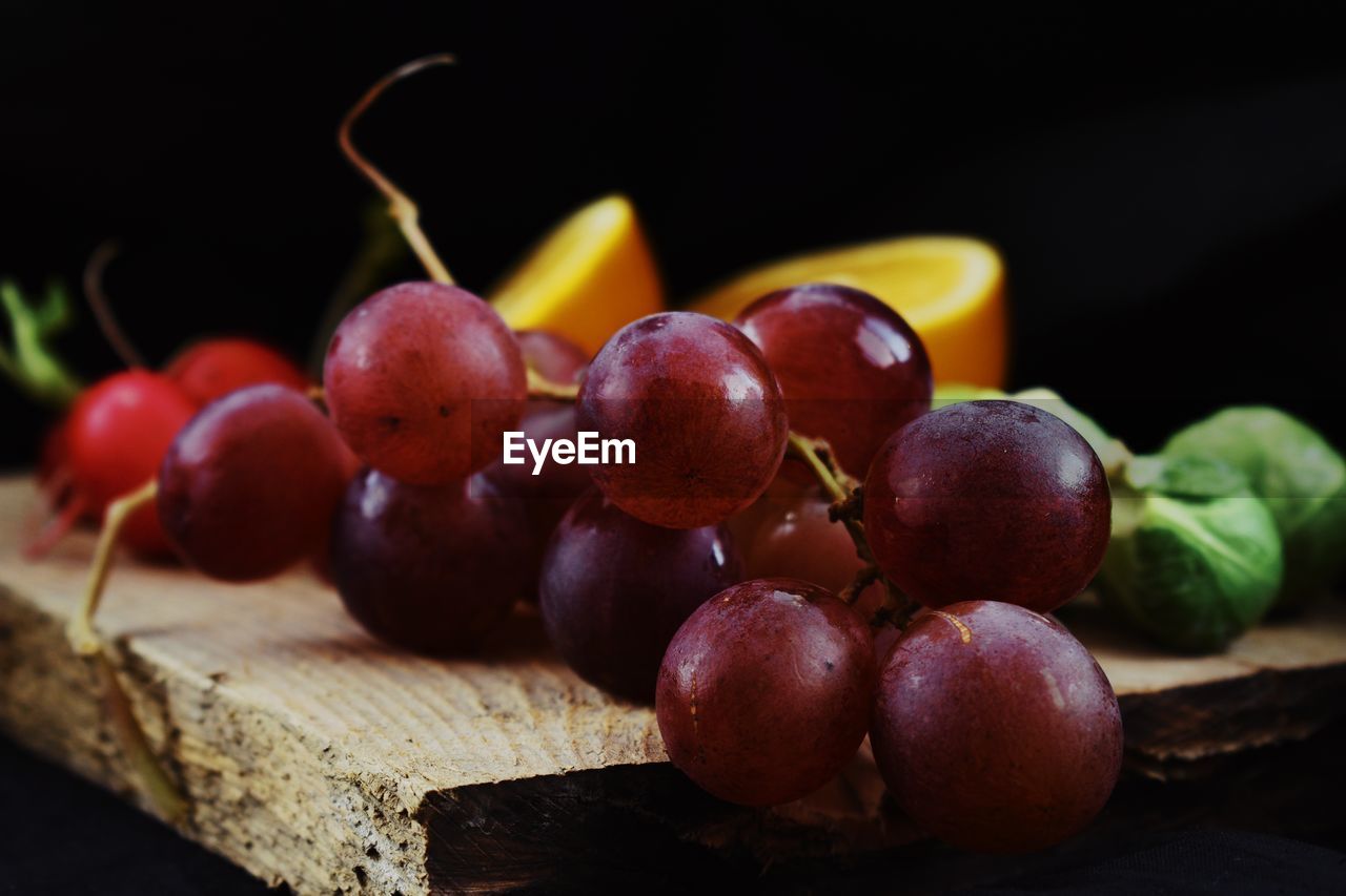 Close-up of grapes on table